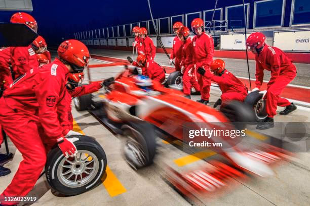 How many NASCAR pit crew members are allowed over the world during a typical pit stop?